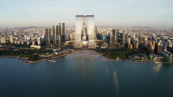 CBD buildings by the lake. Aerial in Suzhou, China alt