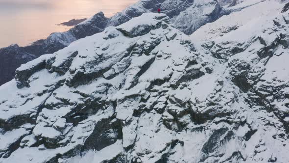Drone Over Hiker On Rugged Mountain Peak alt