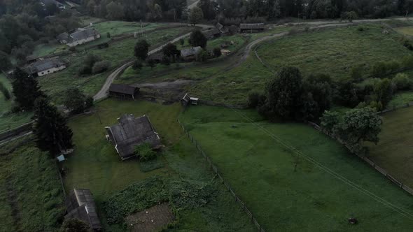 Village on Grassy Mountain Meadows in the Morning alt