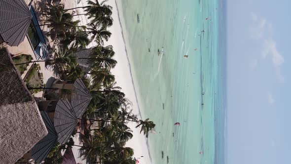 Vertical Video Boats in the Ocean Near the Coast of Zanzibar Tanzania Aerial View alt