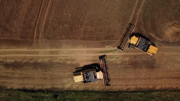 Top Down View of Combine Harvesters Agricultural Machinery. The Machine for Harvesting Grain Crops alt