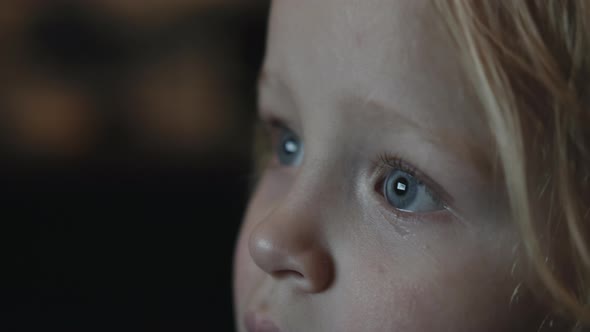 Baby Girl Staring at TV Screen Being Attracted with Something Curious alt