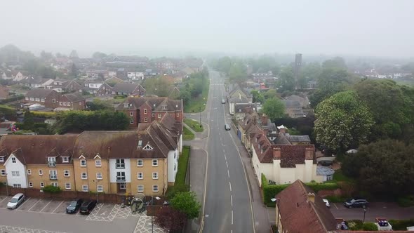Aerial drone slowlying through empty English town in Covid lockdown alt