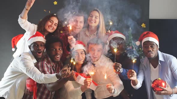 Mixed Race Group of Young People at Christmas Party. Slow Motion.