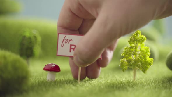 Sign For Rent in an Area with Green Grass Trees and Hills alt