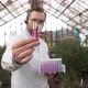 Scientist Holds Test Tubes with Plants in His Hands - VideoHive Item for Sale