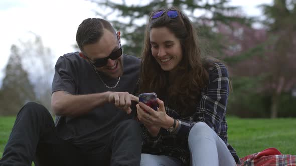 Two young people at park taking selfie together