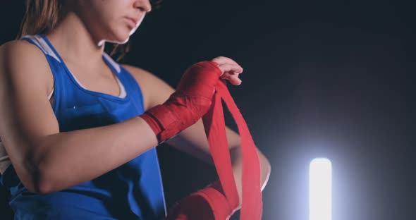 Woman Is Wrapping Hands with Yellow Boxing Wraps alt