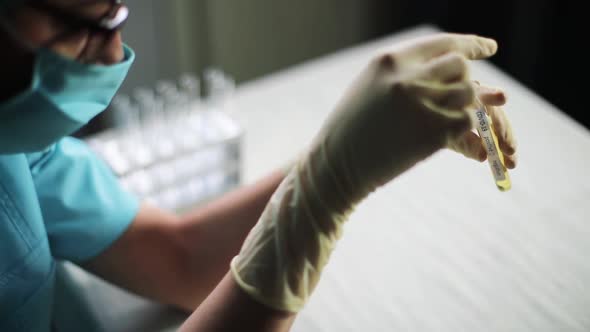 Doctor holding a coronavirus COVID-19 test tube