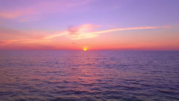 Aerial view Beautiful view sunset or sunrise over sea surface beautiful wave Amazing light twilight alt