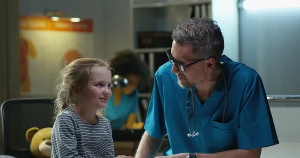Doctor Examining Girl with Stethoscope alt