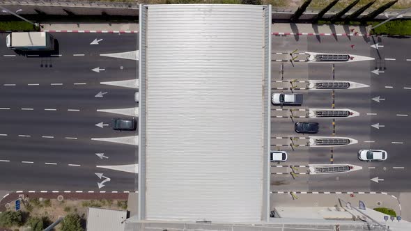 Toll road entrance and exit with traffic in both directions. alt