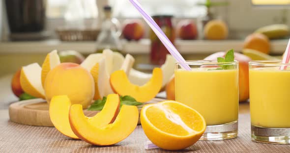 Melon Banana Orange Smoothie and Fresh Fruits alt