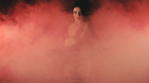 Sexy DJ with White Lenses in the Eyes in Red Smoke alt