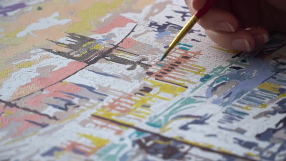 Girl Draws City On Paper With A Brush