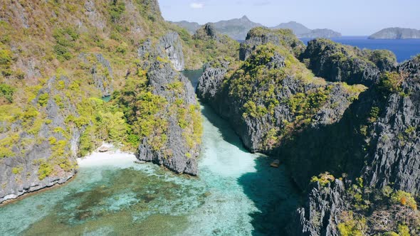 Aerial Footage of Big Lagoon with Sharp Rocks and Clear Blue Water in ElNido Palawan alt