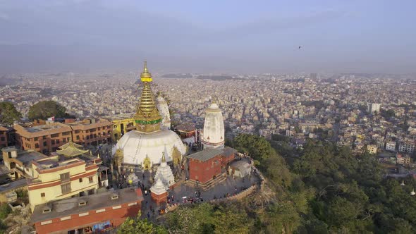 Flying over Swayambhunath Stupa as Black Kites fly alt