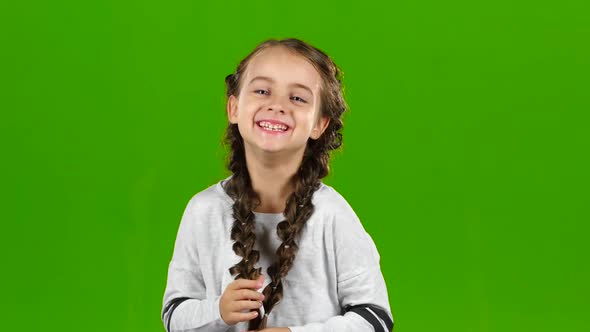 Child Laughs Gaily. Green Screen alt