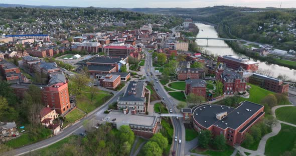 Downtown Morgantown West Virginia. WVU buildings and Monongahela River. Aerial truck shot at golden alt