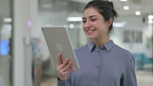 Portrait of Video Call on Tablet By Young Indian Woman alt