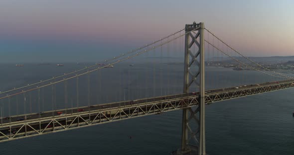 Panning Aerial of the San Francisco Bay Bridge and Skyline at Dusk alt