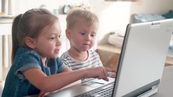 Little Kids Watching Cartoon on Laptop