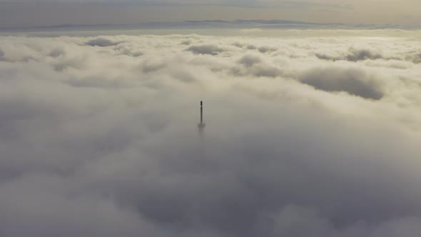 Aerial View of the Upper Part of the Broadcasting Tower in the Fog alt