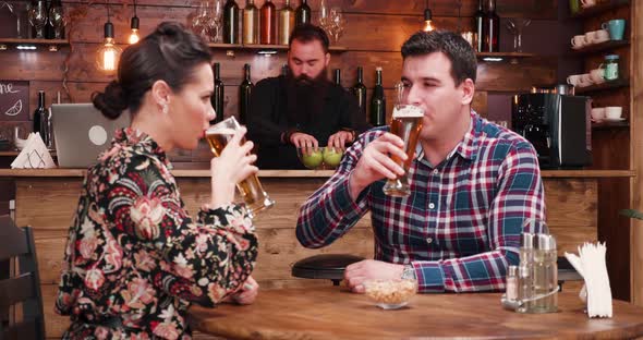 Zoom Out Shot of Happy Inlove Couple Drinking Beer in Stylish Vintage Pub Restaurant alt