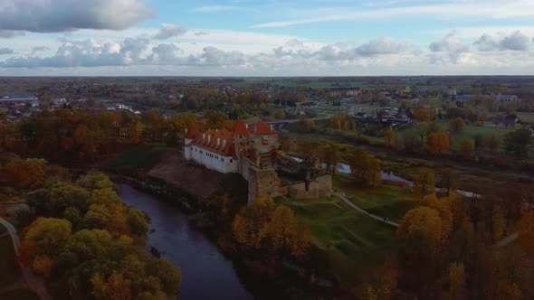 Bauska Medieval Castle Ruins Complex and Park From Above Aerial Shot 4K Video alt