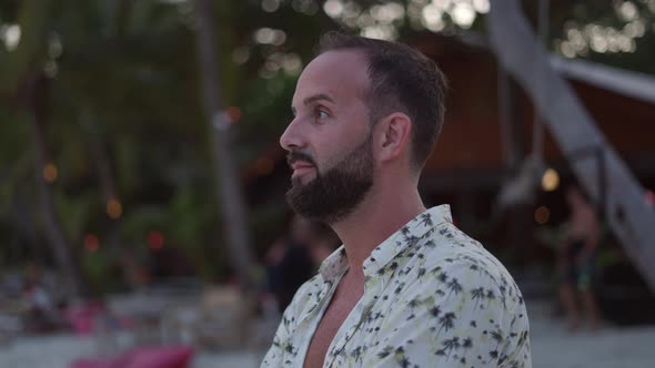 Happy Face of a Man Turning His Sight to Camera and Smile Enjoying Exotic Tropical Nature in the alt