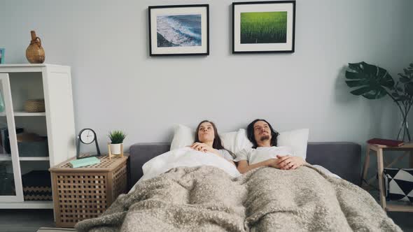 Sleepy People Waking Up in Bed at Home and Leaving Bedroom in Hurry alt