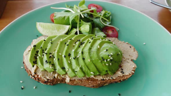 Healthy Avocado Toast with Salad on Plate