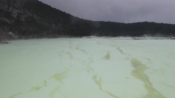 Aerial view fly through smoky in white crater, bandung, Indonesia alt