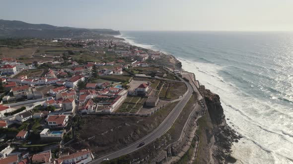 Picturesque town of Azenhas do Mar on high cliffside of Atlantic Ocean. alt