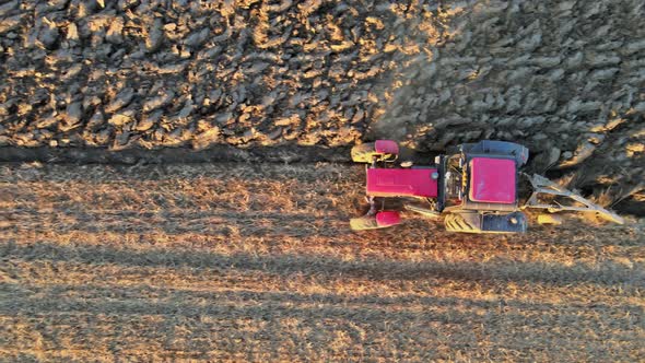 Red Tractor with in Field to Plowing Land Aerial View on of Agricultural Field alt
