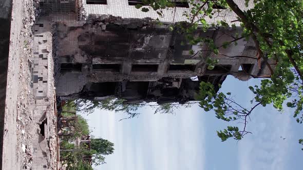 Vertical Video of Civilian Cars Destroyed During the War in Ukraine alt