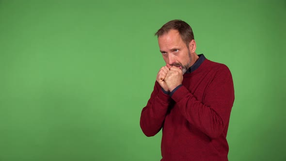 A Middleaged Handsome Caucasian Man is Desperate and Unhappy  Green Screen Background