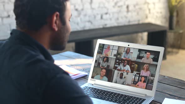Indian Guy Using Laptop Computer for Video Call alt