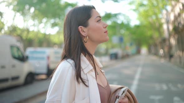 Concentrated brunette woman walking alt