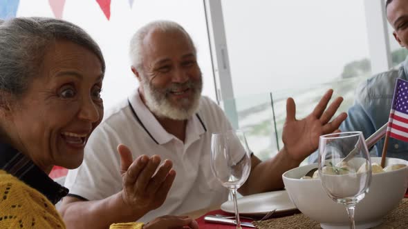 Multi-generation family having celebration meal alt