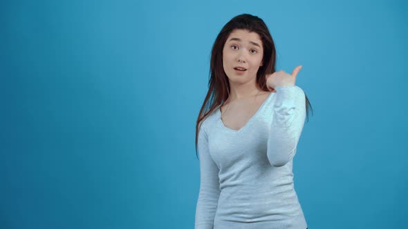 The Young Arrogant Brunette Gestures so As to Draw Attention to Herself Pointing to Her alt