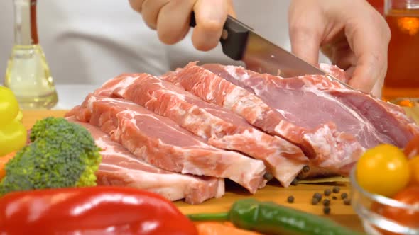 Slicing Fresh Raw Meat for Cooking in Slow Motion