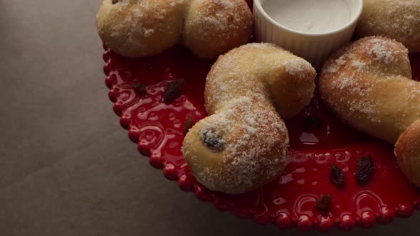 Cameraing over a setup for food photography, freshly baked Swedish Christmas buns (St Lucia saffron alt