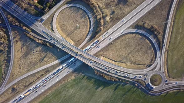 Aerial View of Freeway Intersection with Moving Traffic Cars alt