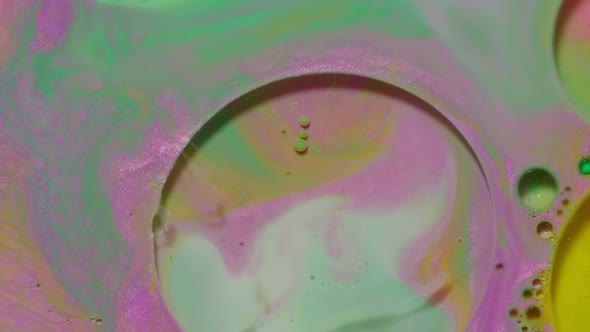 Ink Bubbles Mixed with Liquid Substance of Oil Milk Soap Bright Acrylic Paint on Colorful Surface alt