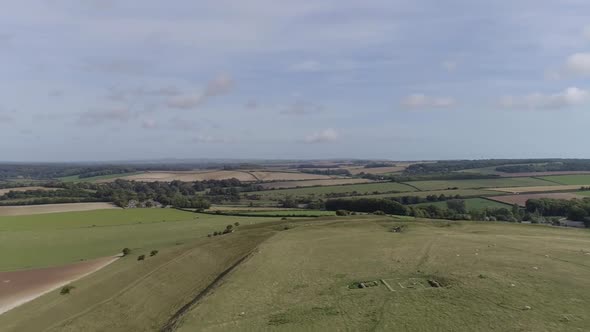 Aerial tracking along the northern ramparts of Maiden castle towards the eastern gate. The Roman tem alt