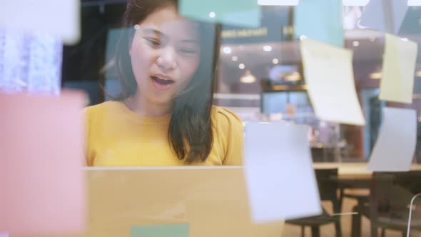 creative agency asian female casual cloth video conference online meeting working with laptop alt