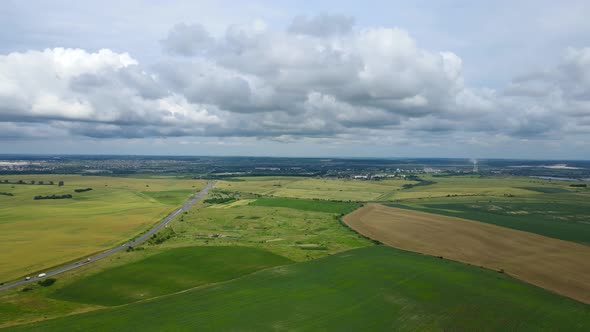 Aerial View From The Field To The City With Rain Clouds In Ukraine