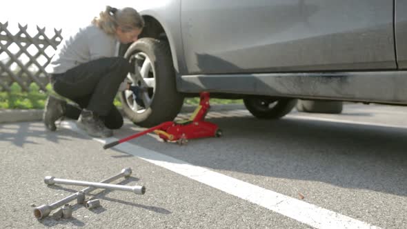 Woman During Tire Change alt