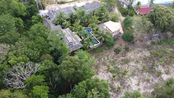Happy Holiday in Asia Swimming Pool Surrounding Palms and Green Garden in the Beautiful Tropical alt